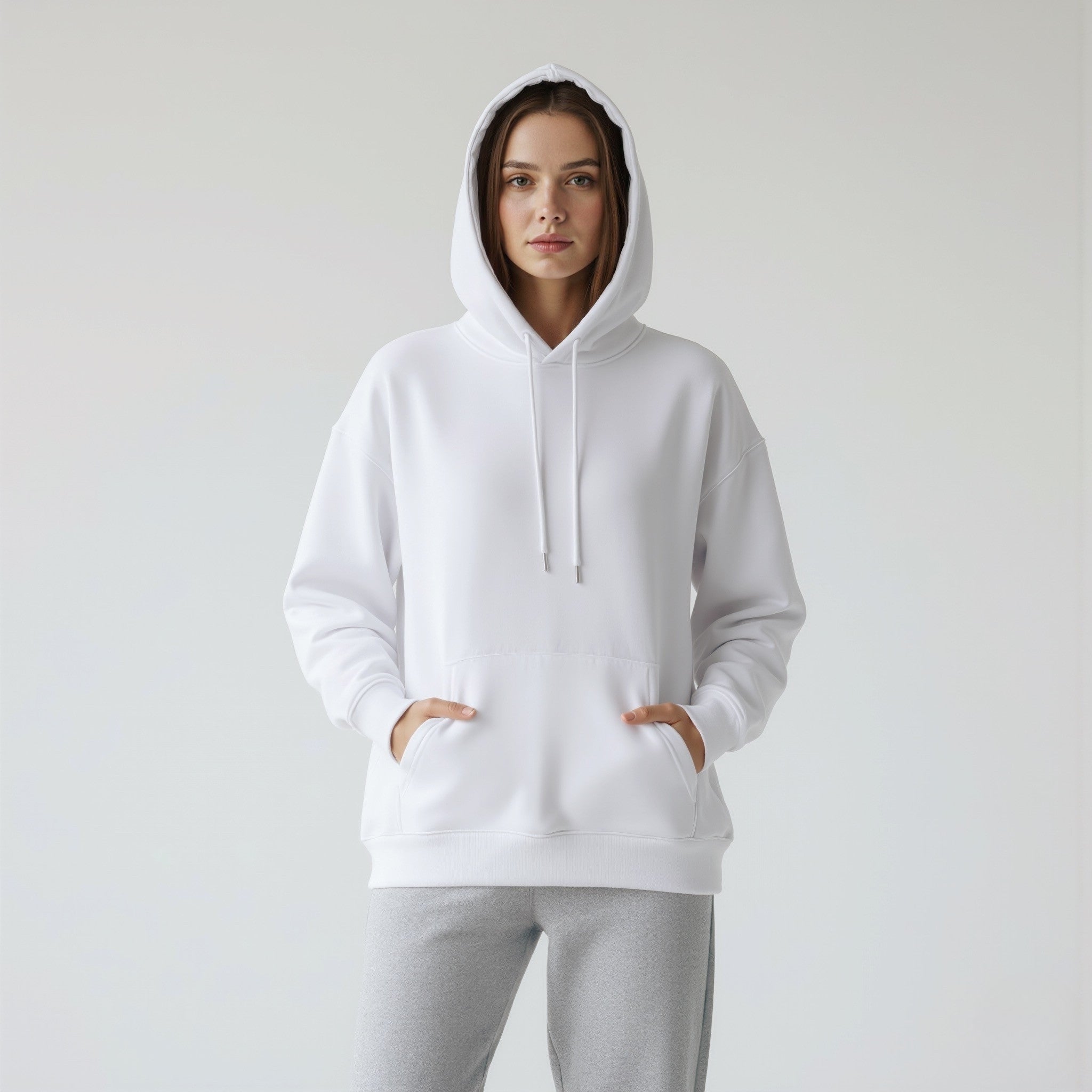 Person wearing a moleculuxe pristine white hoodie on a plain background